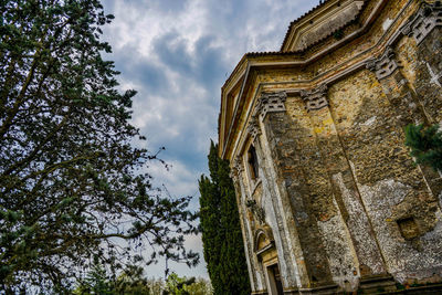 Low angle view of old building against sky