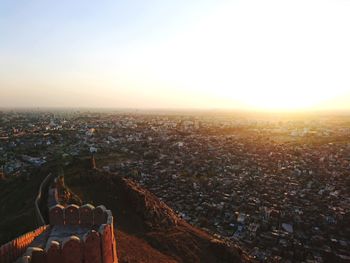 High angle view of city against sky during sunset