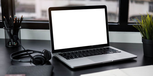 Close-up of laptop on table