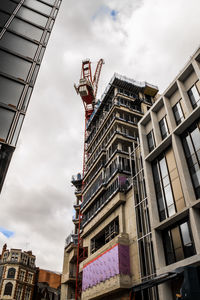 Low angle view of buildings against sky in city