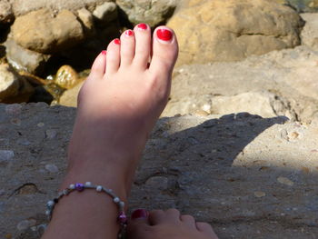 Low section of woman legs on beach