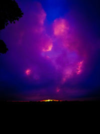 Silhouette landscape against scenic sky