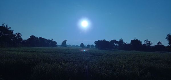 Scenic view of field against sky at night