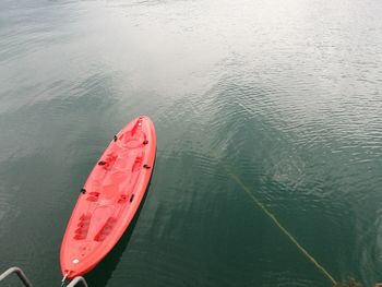 Close-up of red kayak boat on lake