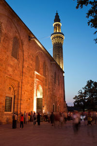 Group of people in front of historic building