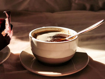 Close-up of coffee cup on table
