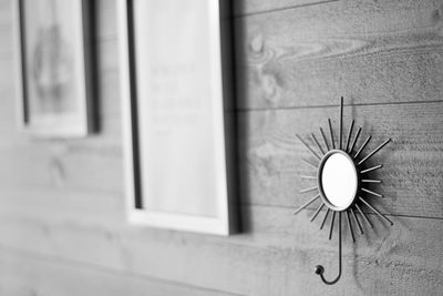 Close-up of clock on window