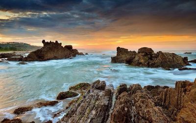 Scenic view of sea at sunset