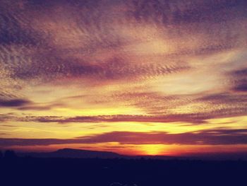 Scenic view of landscape against cloudy sky