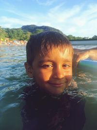 Portrait of smiling boy in water