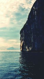 Scenic view of sea against cloudy sky