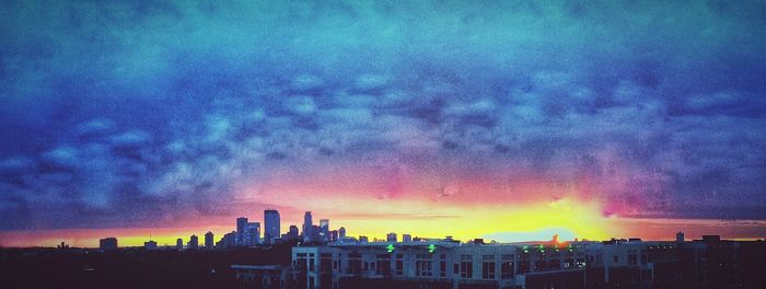 Dramatic sky over city during sunset