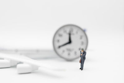 Man standing in front of clock