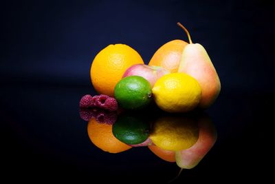 Close-up of oranges against black background