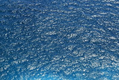 Full frame shot of ice against blue sky