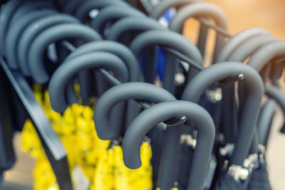 Close-up of chain hanging on metal grate