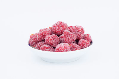 Close-up of strawberries in bowl against white background