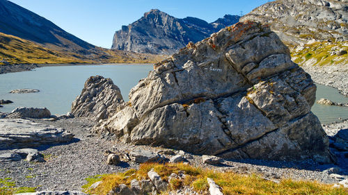 Scenic view of rocks in mountains against sky