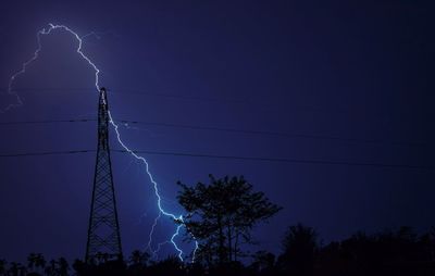 Low angle view of lightning in sky at night