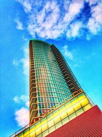 Low angle view of building against cloudy sky