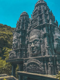 Low angle view of statue of temple against building