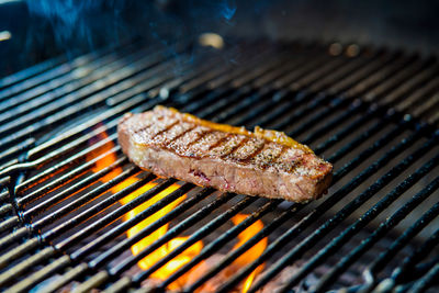 High angle view of meat on barbecue grill