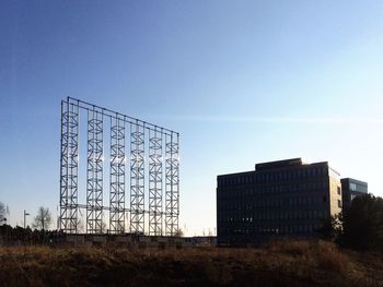 Low angle view of built structure against clear blue sky