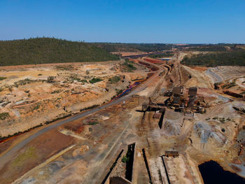 High angle view of construction site against clear blue sky