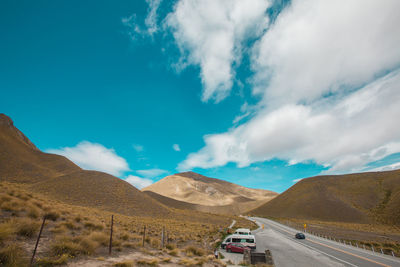 Cars on road against sky