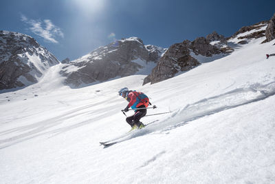 Man skiing on snowcapped mountain