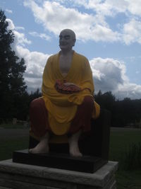 Statue of buddha against sky