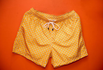 Close-up of shorts over colored background