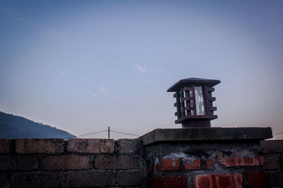 Traditional windmill against sky