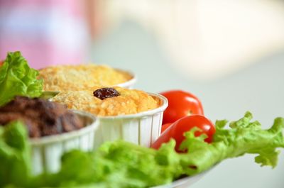 Close-up of cupcakes served with salad