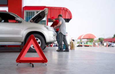 Rear view of man standing on road