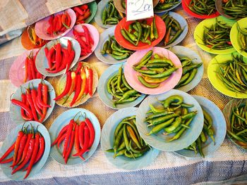 Close-up of multi colored peppers in plates on table