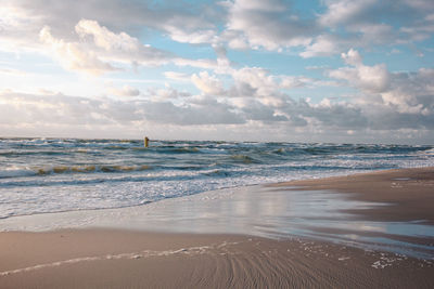 Scenic view of beach against sky