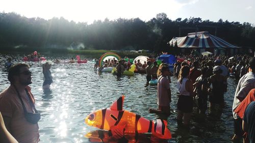 People standing by river