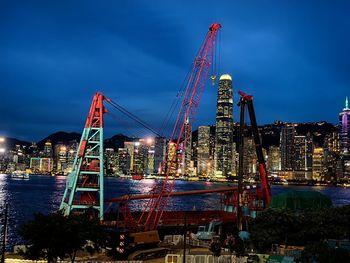 Illuminated cityscape against sky