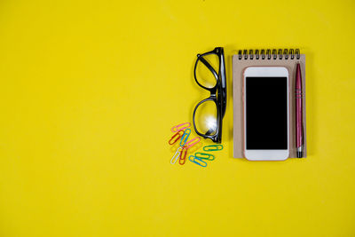 Telephone booth on yellow table