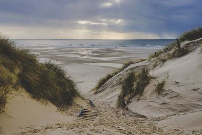 Scenic view of beach against sky