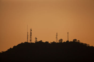 Low angle view of silhouette trees against sky during sunset