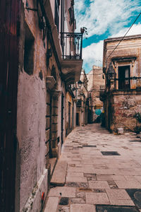 Alley amidst buildings in city