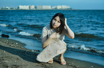 Young woman standing on beach