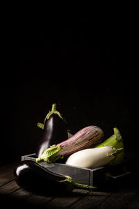 High angle view of cutting board on table against black background