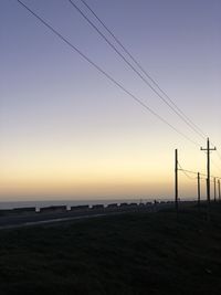 Scenic view of silhouette landscape against clear sky during sunset