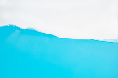 Close-up of blue sea against clear sky