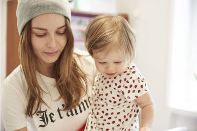 Close-up of mother and daughter at home