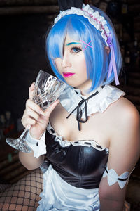 Portrait of waitress with dyed hair in restaurant