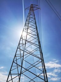 Low angle view of electricity pylon against sky